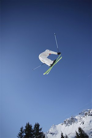 ski jumping - Skier Flying Through the Air Fotografie stock - Premium Royalty-Free, Codice: 622-01695709