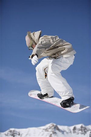 simsearch:622-01695701,k - Snowboarder Flying Through the Air Fotografie stock - Premium Royalty-Free, Codice: 622-01695701