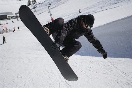 simsearch:622-01695701,k - Snowboarder Riding a Half-Pipe Fotografie stock - Premium Royalty-Free, Codice: 622-01695702