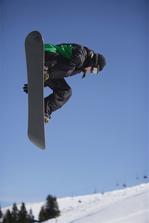 simsearch:622-01695701,k - Snowboarder Flying Through the Air Fotografie stock - Premium Royalty-Free, Codice: 622-01695720