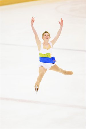 patinação artística - Leaping Figure Skater Foto de stock - Royalty Free Premium, Número: 622-01695872