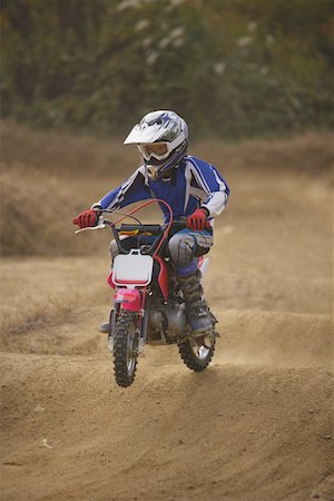 driving dirt - Dirtbiking over Mounds Stock Photo - Premium Royalty-Free, Code: 622-01956311