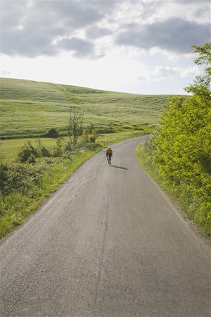 simsearch:858-03049509,k - Cyclist on road through hills Stock Photo - Premium Royalty-Free, Code: 622-02198541