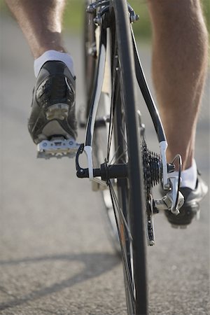 Detail of a cyclist pedaling Stock Photo - Premium Royalty-Free, Code: 622-02198550