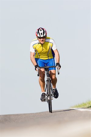 simsearch:858-03049522,k - Cyclist riding bicycle,  front view Stock Photo - Premium Royalty-Free, Code: 622-02198565