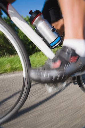 simsearch:858-03049054,k - Blurred motion of a cyclist pedaling Stock Photo - Premium Royalty-Free, Code: 622-02198560
