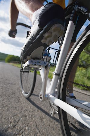 pedal - Close-up of a cyclist cycling on road Stock Photo - Premium Royalty-Free, Code: 622-02198598