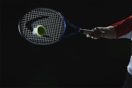 Tennis Player Swinging at Ball Stock Photo - Premium Royalty-Free, Code: 622-02198621