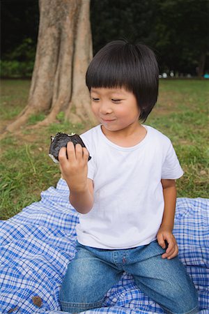 Smiling boy enjoying chocolate cake Stock Photo - Premium Royalty-Free, Code: 622-02354142