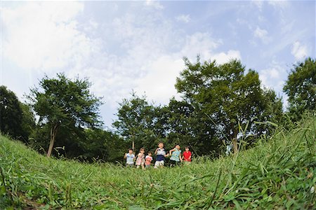 run in park asian - Children running in park together Stock Photo - Premium Royalty-Free, Code: 622-02354161