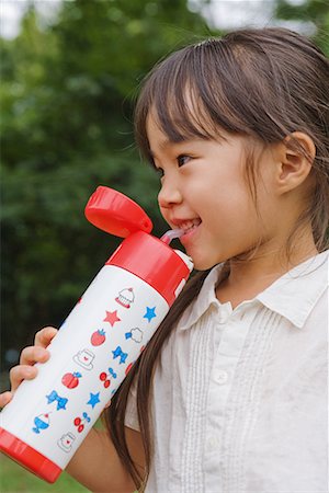 plastic water bottle - Girl drinking water from water bottle Stock Photo - Premium Royalty-Free, Code: 622-02354237