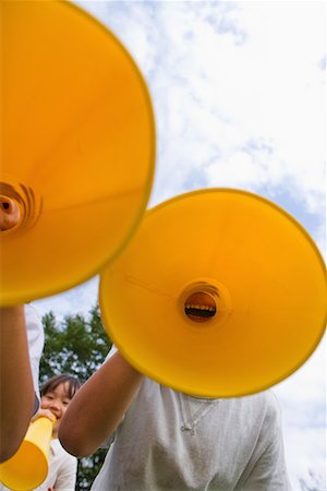 simsearch:622-02354257,k - Children cheering through megaphone Stock Photo - Premium Royalty-Free, Code: 622-02354256