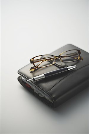 eyeglasses detail - Leather diary with fountain pen and specs Stock Photo - Premium Royalty-Free, Code: 622-02354345