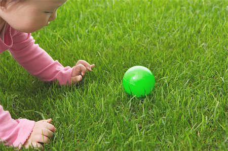 Toddler baby playing with ball Stock Photo - Premium Royalty-Free, Code: 622-02395629