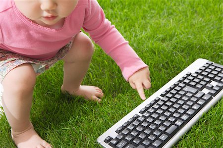 Baby pointing to keyboard Stock Photo - Premium Royalty-Free, Code: 622-02395633