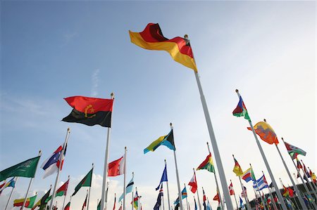 simsearch:622-02621533,k - Multinational flags waving against sky Stock Photo - Premium Royalty-Free, Code: 622-02621534