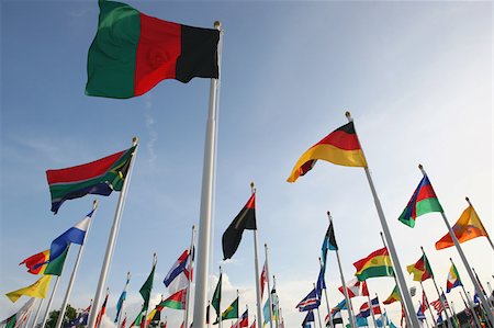 symbols international - Multinational flags waving against sky Stock Photo - Premium Royalty-Free, Code: 622-02621533