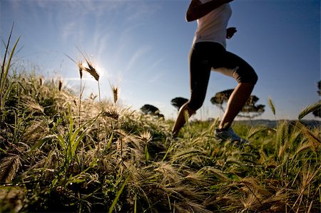 Girl jogging in countryside Stock Photo - Premium Royalty-Free, Code: 622-02621559