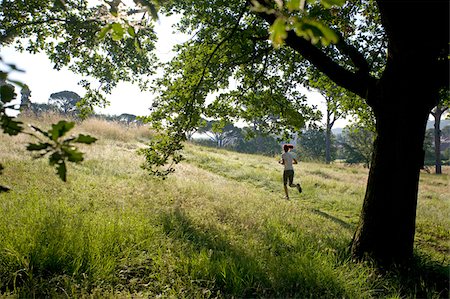 Girl jogging in countryside Stock Photo - Premium Royalty-Free, Code: 622-02621568