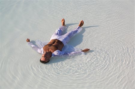 simsearch:622-02621605,k - Man lying on the beach Stock Photo - Premium Royalty-Free, Code: 622-02621603