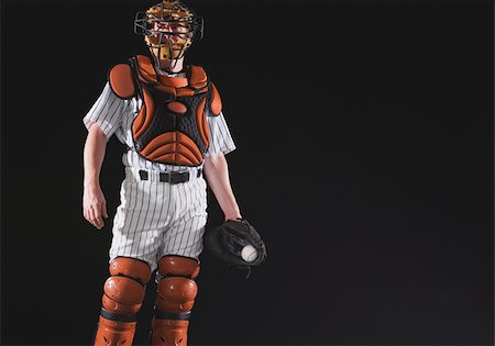 sports equipment cutout - Baseball catcher holding ball in mitt Stock Photo - Premium Royalty-Free, Code: 622-02621706