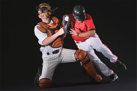 Joueur de baseball glissant dans une base Photographie de stock - Premium Libres de Droits, Code: 622-02621708
