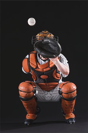Baseball catcher catching ball Fotografie stock - Premium Royalty-Free, Codice: 622-02621701