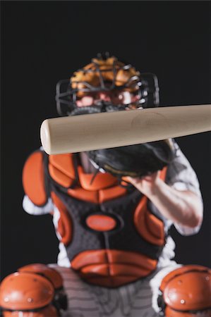 simsearch:622-02354223,k - A baseball bat in front of a baseball umpire Stock Photo - Premium Royalty-Free, Code: 622-02621711