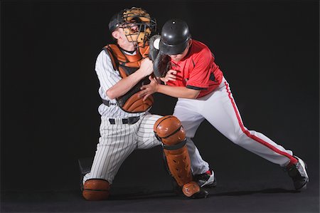 Baseball player sliding into a base Fotografie stock - Premium Royalty-Free, Codice: 622-02621725