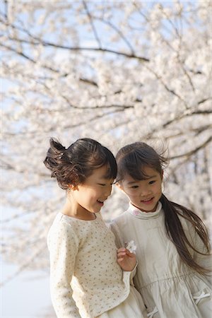simsearch:622-02395700,k - Two Japanese sisters smiling and looking down Stock Photo - Premium Royalty-Free, Code: 622-02758501