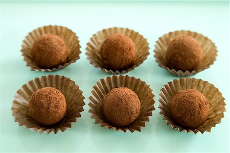 simsearch:689-03129913,k - Chocolate Truffle on Green Background Stock Photo - Premium Royalty-Free, Code: 622-02758620