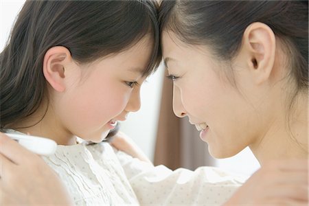 simsearch:622-02759194,k - Mother leaning her head against daughter Stock Photo - Premium Royalty-Free, Code: 622-02759092