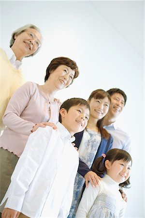 Asian family standing together Stock Photo - Premium Royalty-Free, Code: 622-02759114