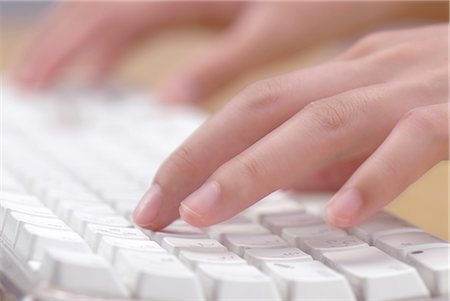 finger on pc - Hands Typing on a White Keyboard Stock Photo - Premium Royalty-Free, Code: 622-02759355