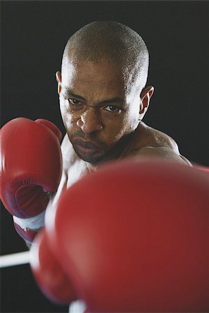 African boxer wearing Boxing gloves Stock Photo - Premium Royalty-Free, Code: 622-02913220