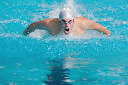 simsearch:622-02913244,k - Swimmer swimming   butterfly stroke Fotografie stock - Premium Royalty-Free, Codice: 622-02913281