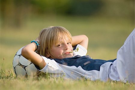 Soccer player with head on football Stock Photo - Premium Royalty-Free, Code: 622-02913346