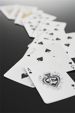 Playing cards showing suit of spades Foto de stock - Sin royalties Premium, Código: 622-02913381