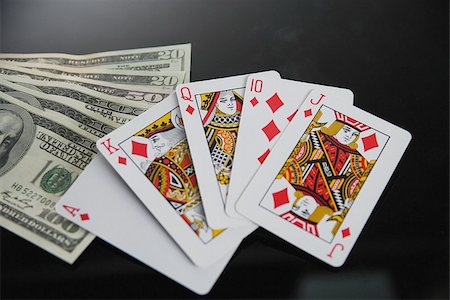 poker - Royal flush in diamond and dollars in studio Stock Photo - Premium Royalty-Free, Code: 622-02913392