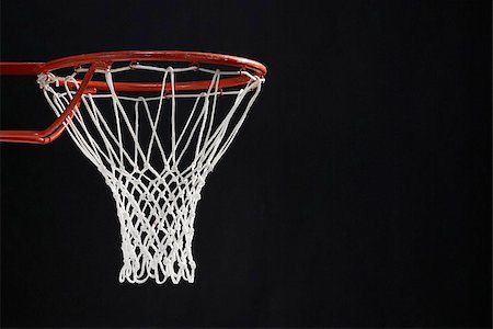 sports equipment cutout - Empty basketball hoop against black background Stock Photo - Premium Royalty-Free, Code: 622-02913451