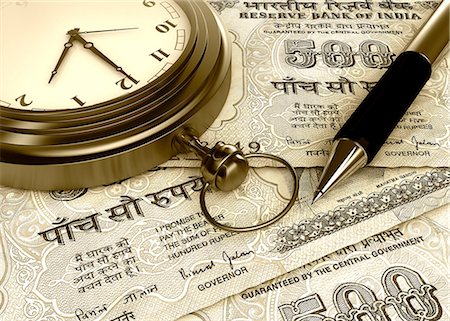 Pocket watch with a pen on Indian five hundred rupee notes Stock Photo - Premium Royalty-Free, Code: 630-06724435