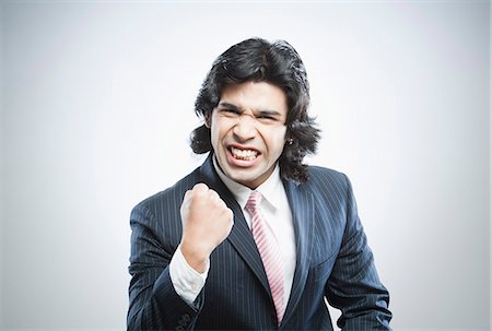 Businessman clenching fist Stock Photo - Premium Royalty-Free, Code: 630-06724726