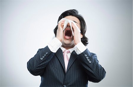 someone about to sneeze - Businessman sneezing Stock Photo - Premium Royalty-Free, Code: 630-06724731
