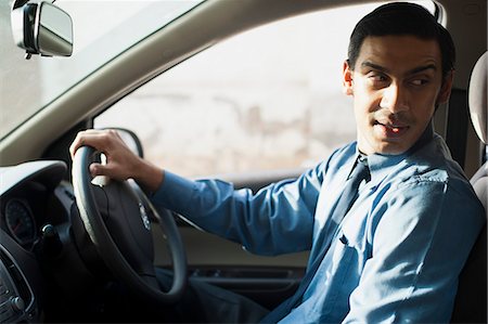 simsearch:630-06723049,k - Bengali businessman driving a car Stock Photo - Premium Royalty-Free, Code: 630-06724895