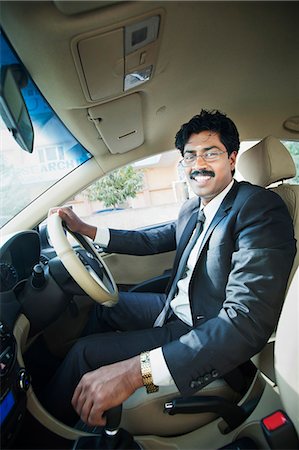 simsearch:630-06724909,k - South Indian businessman driving the car Photographie de stock - Premium Libres de Droits, Code: 630-06724909