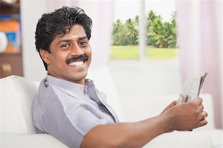 smiling indian mustache - South Indian man reading a newspaper Photographie de stock - Premium Libres de Droits, Code: 630-06724923