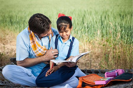 Farmer teaching his daughter in the field, Sohna, Haryana, India Stock Photo - Premium Royalty-Free, Code: 630-06724946