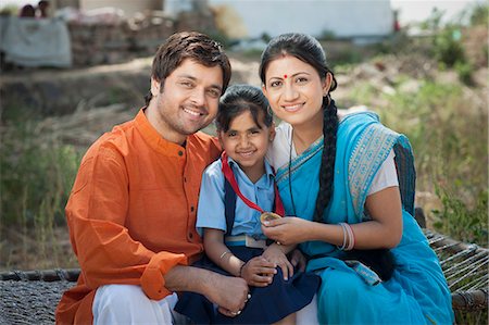 father children not grandparent asian - Rural couple enjoying the achievement of their daughter, Sohna, Haryana, India Stock Photo - Premium Royalty-Free, Code: 630-06724965