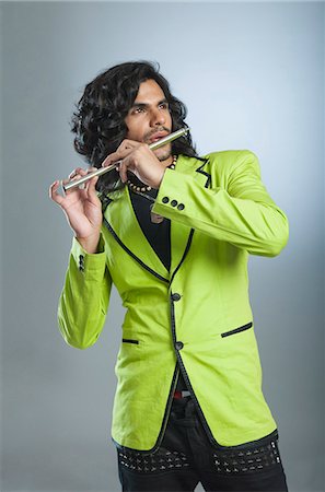 simsearch:6108-08725387,k - Man playing a flute Stock Photo - Premium Royalty-Free, Code: 630-06722276