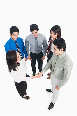 simsearch:630-06722626,k - Business executives shaking hands Stock Photo - Premium Royalty-Free, Code: 630-06722349